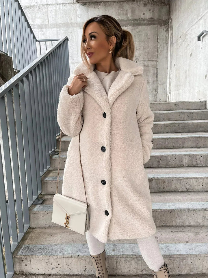 Warm women's teddy longline coat, perfect for winter fashion and cozy everyday style.