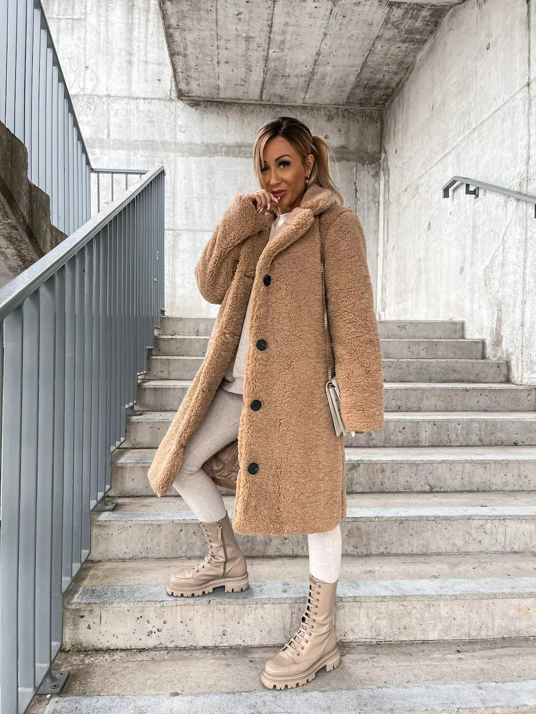 Chic women's longline teddy coat, a stylish faux fur jacket for cool weather fashion.