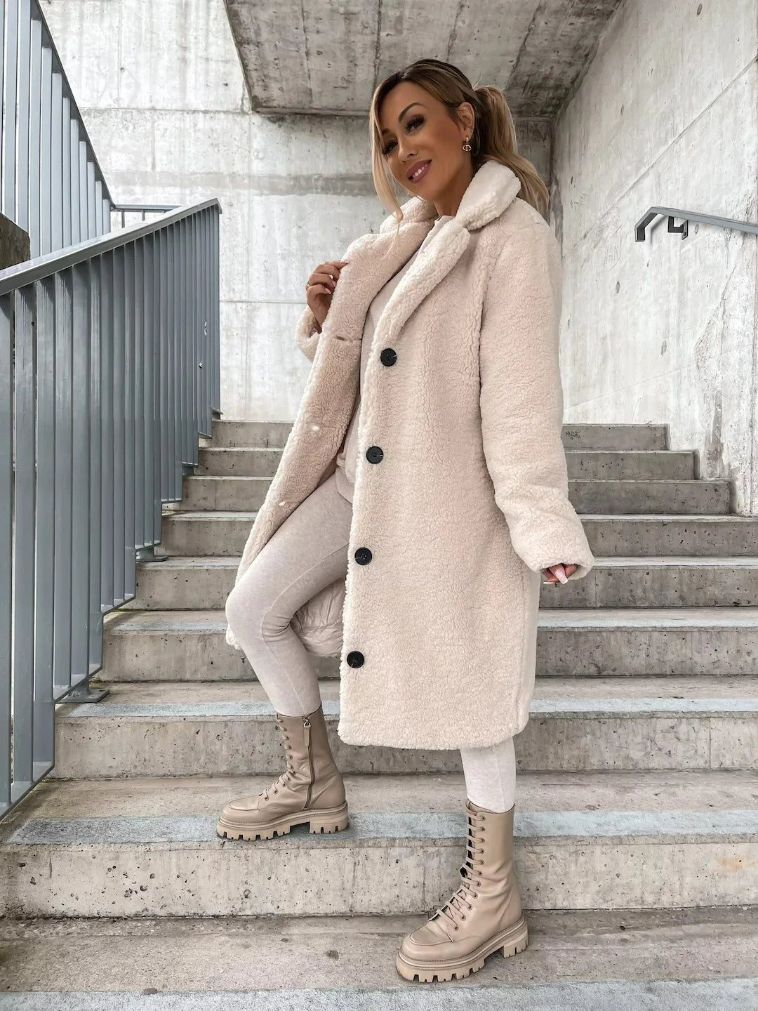 Soft women's longline teddy coat, offering warmth and style for winter & fall outerwear.