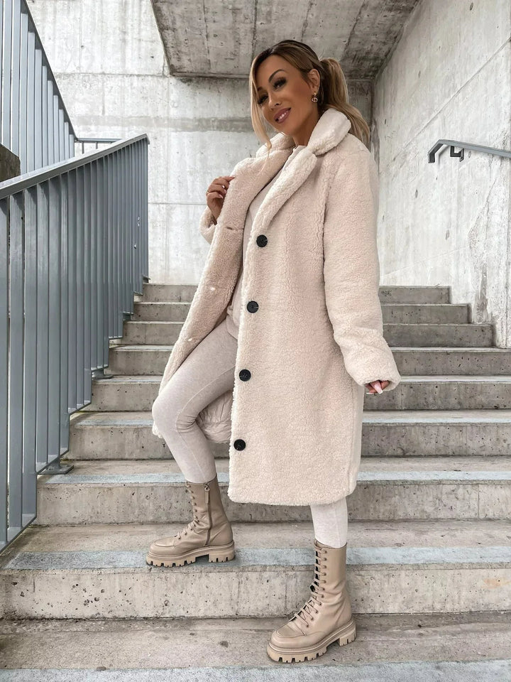 Soft women's longline teddy coat, offering warmth and style for winter & fall outerwear.