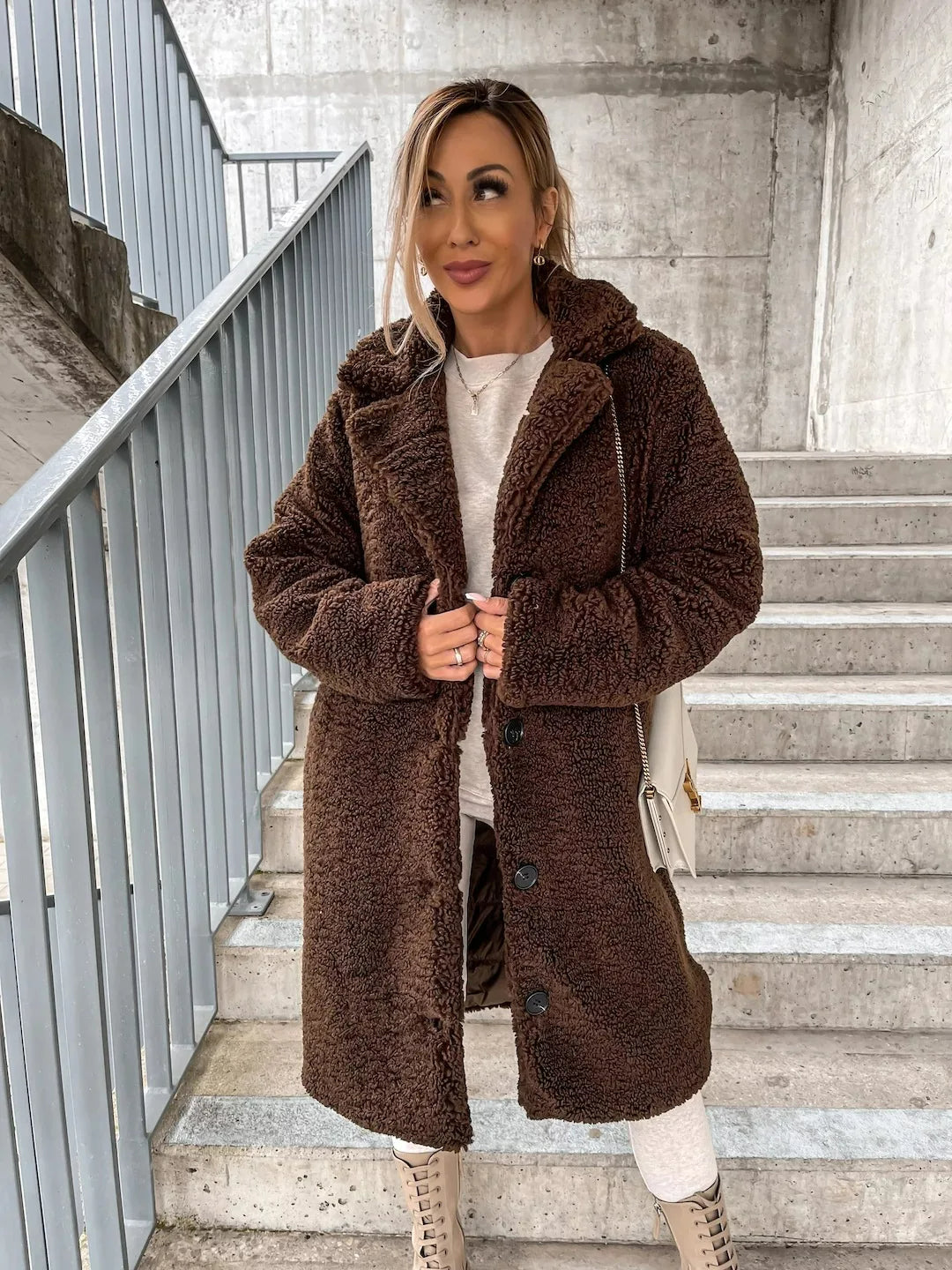 Women's warm longline teddy coat, a cozy and stylish outerwear piece for winter fashion.