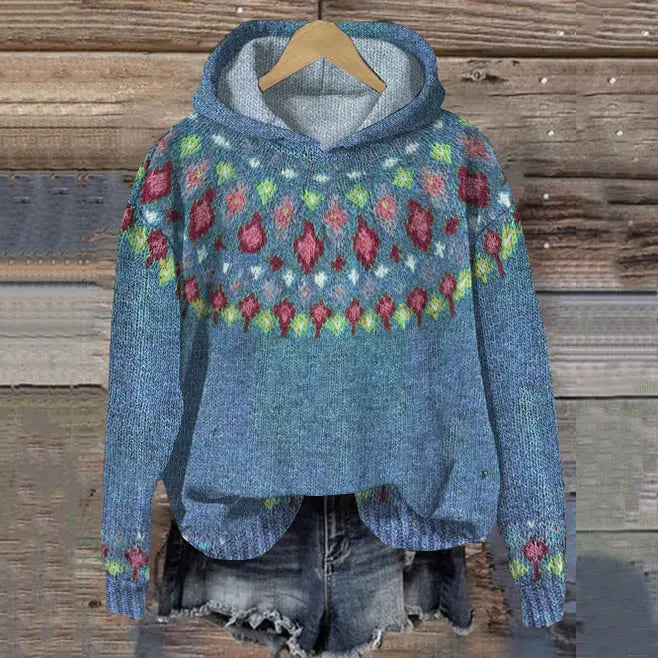 Warm women's Scandinavian style hoodie. Cozy Nordic patterned pullover sweatshirt ideal for winter comfort.