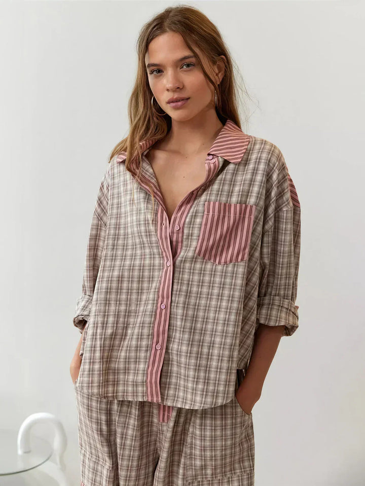 Women's cozy pink plaid button-up pajama set. Relaxed fit 2-piece sleepwear for ultimate comfort.
