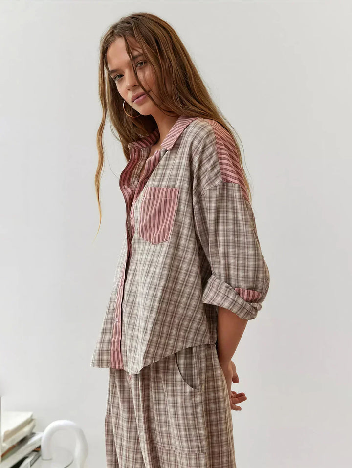 Stylish blue plaid button-up pajama set for women. Comfortable 2-piece loungewear.