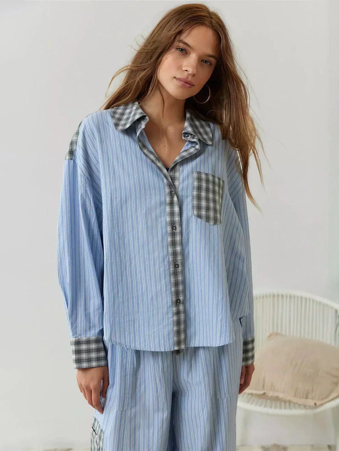 Close-up of a women's 2-piece plaid button-up pajama set, showcasing soft fabric and design.