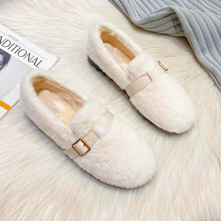 Plush women's flat shoes, offering cozy warmth & ultimate comfort. Ideal slip-on footwear for winter casual wear.