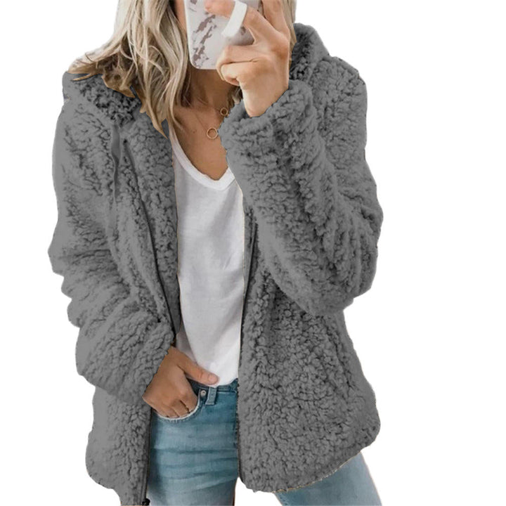 Cozy women's long-sleeve plush jacket with practical front pockets, ideal for layering in fall & winter.
