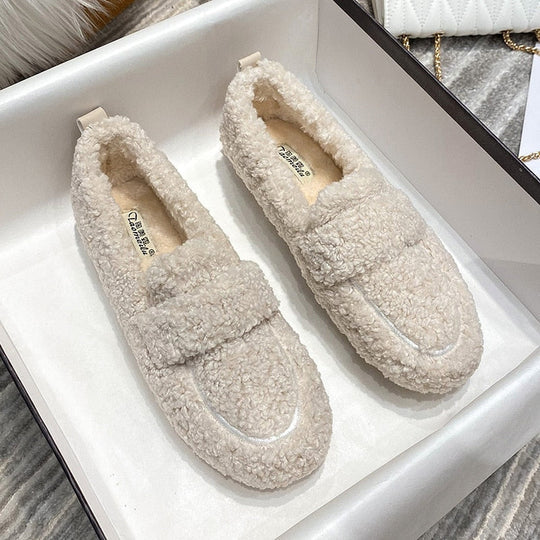 Soft plush loafer slippers for women, featuring a cozy interior and slip-on design for warmth & comfort.