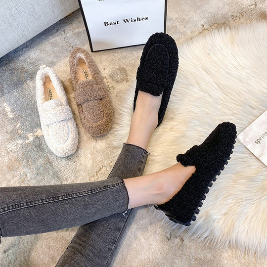 Cozy women's plush loafer slippers with a soft lining and easy slip-on style, ideal for indoor relaxation.