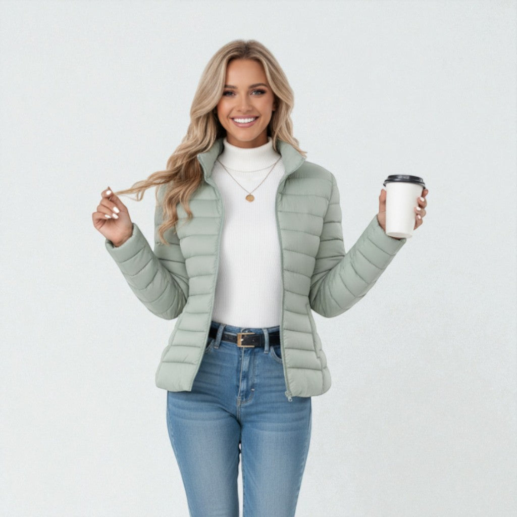 Women's quilted winter jacket with stand collar, zip closure, and cozy lightweight design for fall fashion.