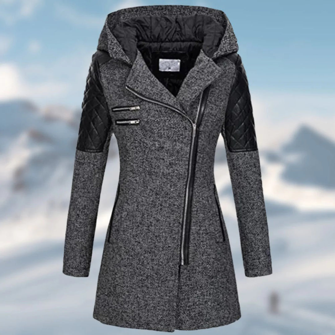 Detail of the collar and zipper on a women's warm winter jacket, a cozy quilted coat.