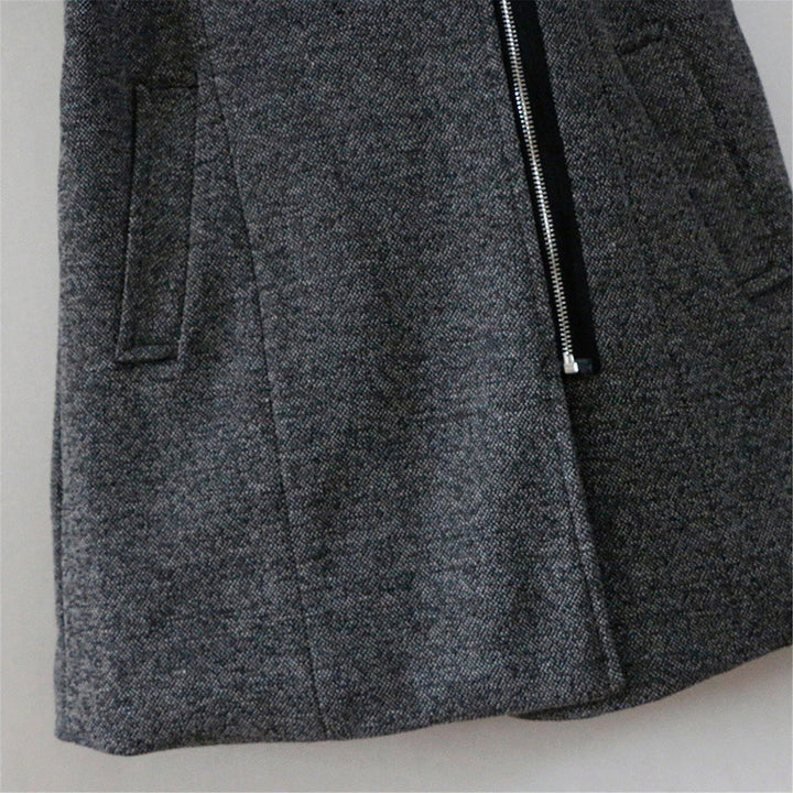 Close-up of the textured quilted sleeve on a women's stylish winter coat. Cozy & elegant design.