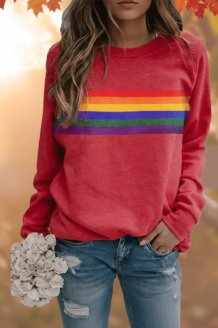 Women's cozy rainbow striped sweatshirt with long sleeves, perfect for casual, everyday retro fashion.