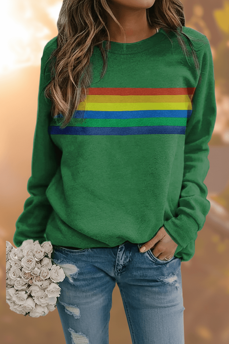Cozy women's rainbow striped sweatshirt. Comfortable long sleeve top perfect for casual vintage style.