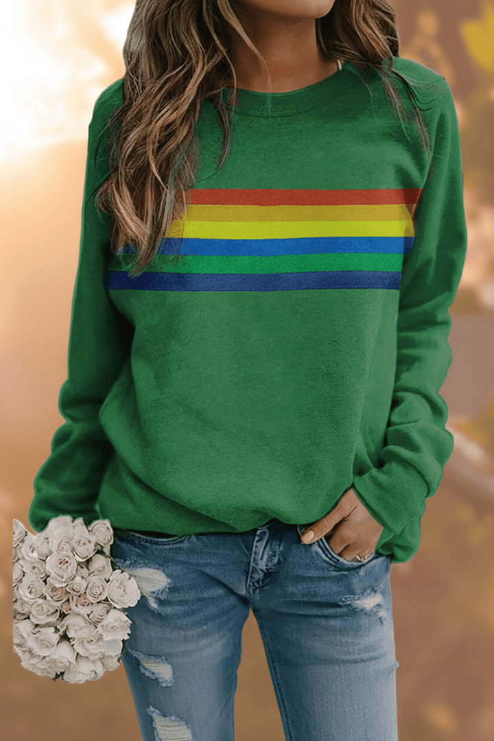Cozy women's rainbow striped sweatshirt. Comfortable long sleeve top perfect for casual vintage style.