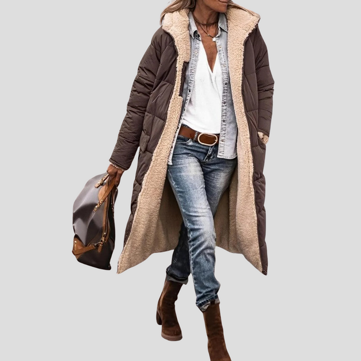 Warm women's long winter jacket. Reversible hooded design provides ultimate coziness for cold weather.