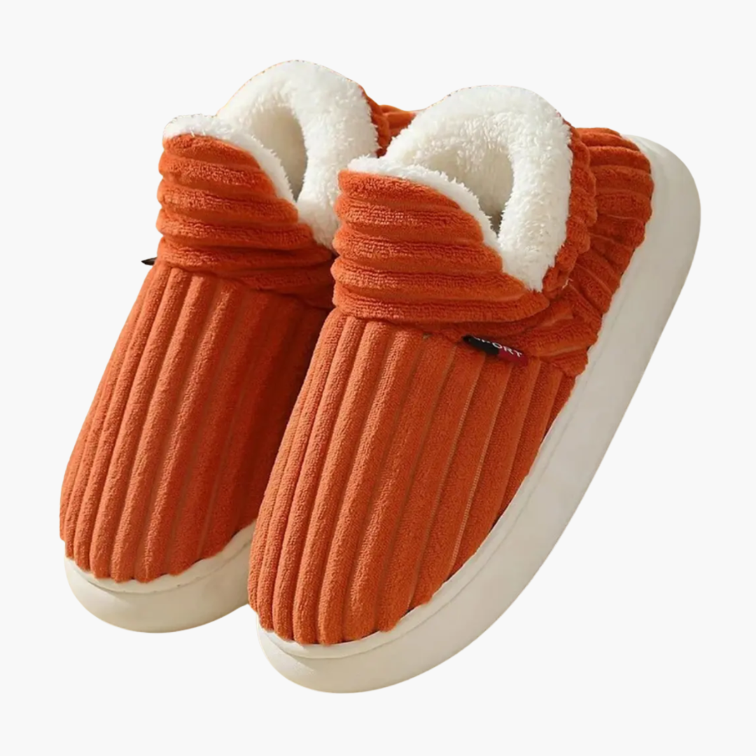 Women's cozy ribbed bootie slippers for warm indoor comfort. Plush fall/winter slip-on house shoes.