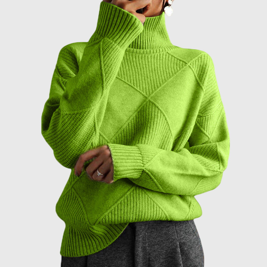 Warm women's oversized jumper, a stylish roll neck knit for ultimate winter comfort.