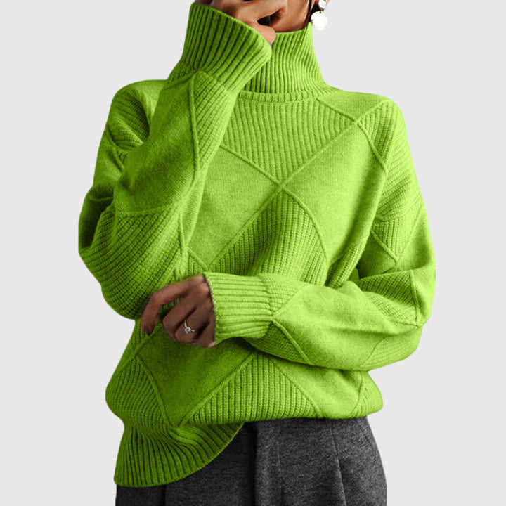 Warm women's oversized jumper, a stylish roll neck knit for ultimate winter comfort.