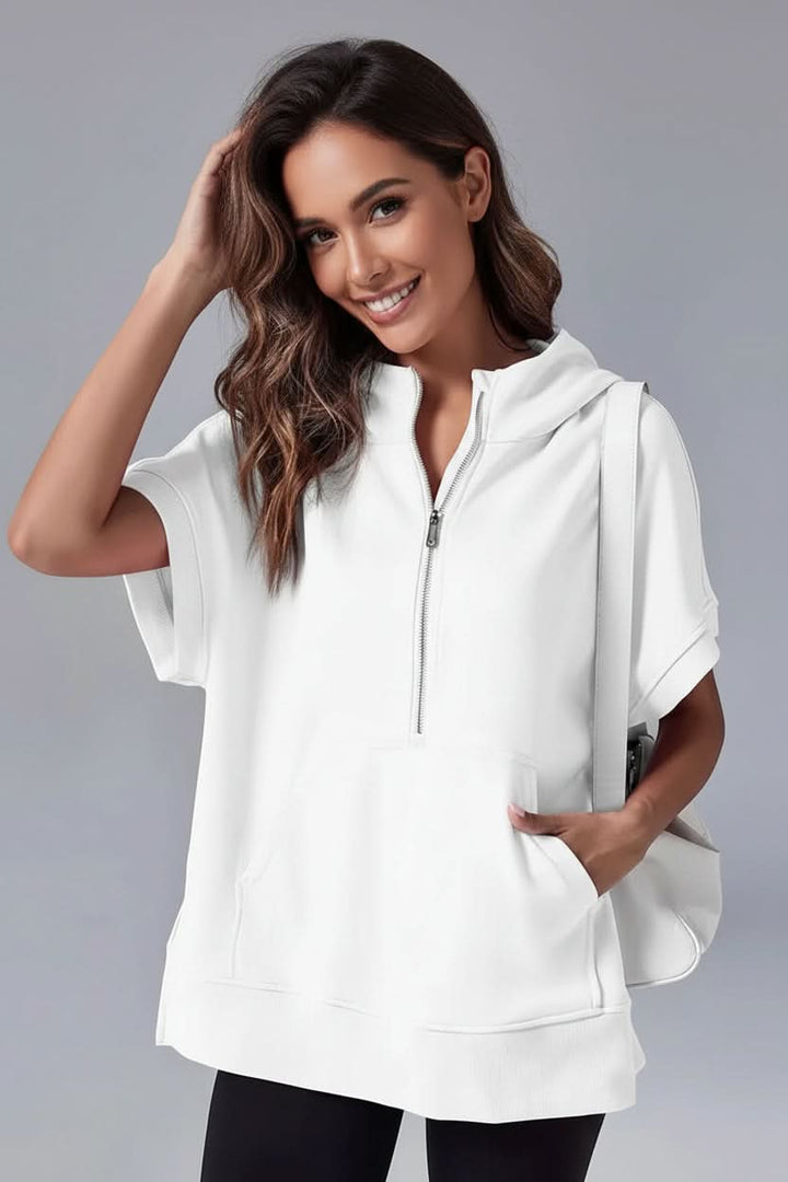 Comfortable women's short sleeve hoodie with half-zip, great for loungewear or casual outfits.