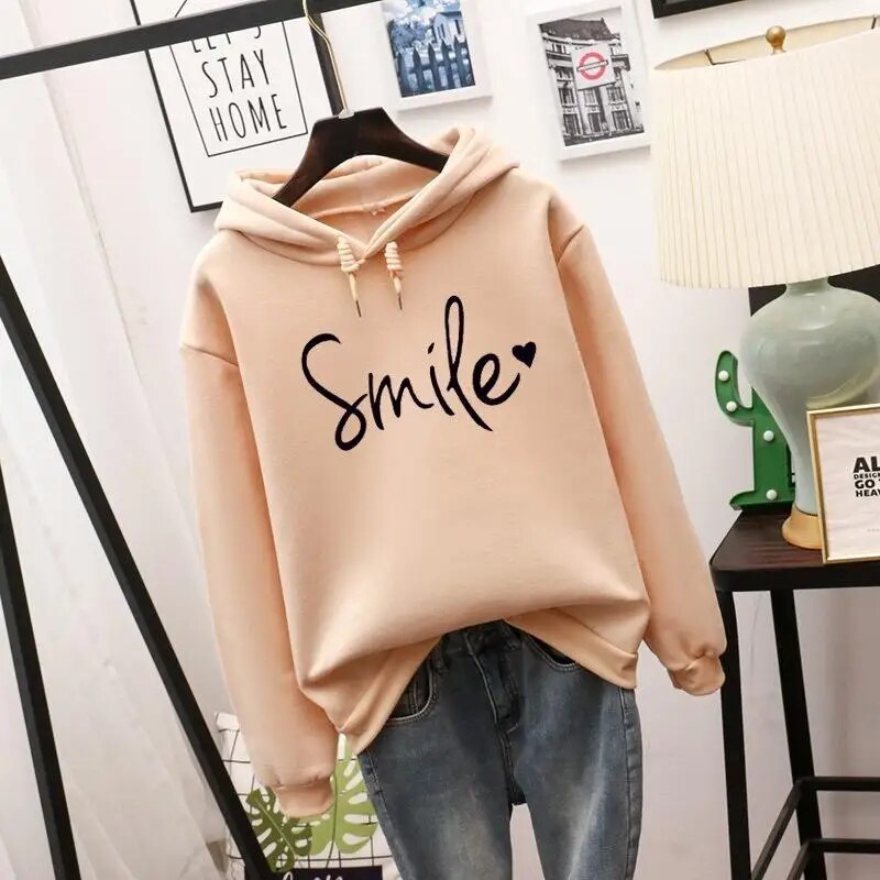 Women's cozy smile graphic hoodie, comfortable pullover for casual everyday wear. Long sleeve top with positive vibes.