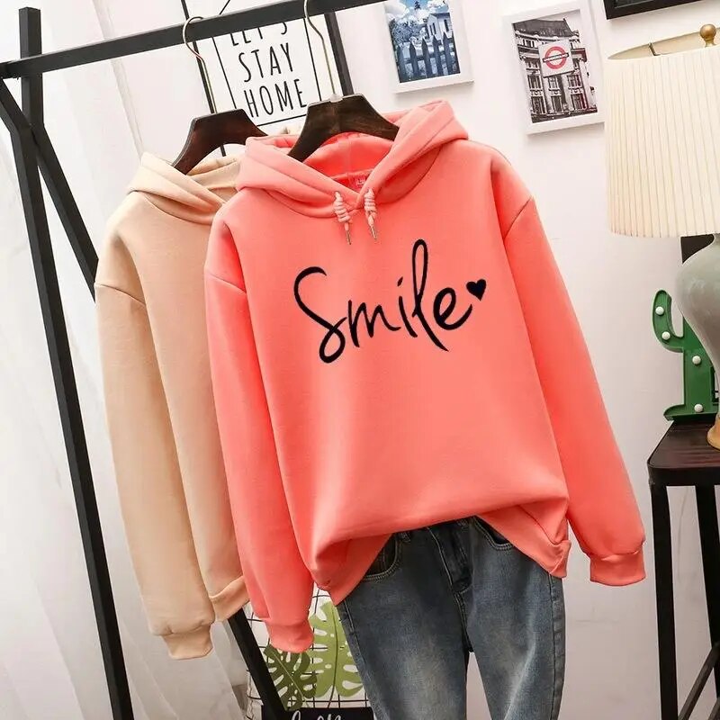 Stylish women's long sleeve cozy hoodie with a smile graphic. Perfect casual pullover for everyday comfort.