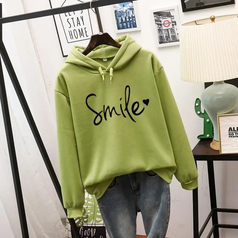 Casual women's graphic hoodie with a cozy feel & smile design. Long sleeve pullover for comfortable everyday fashion.