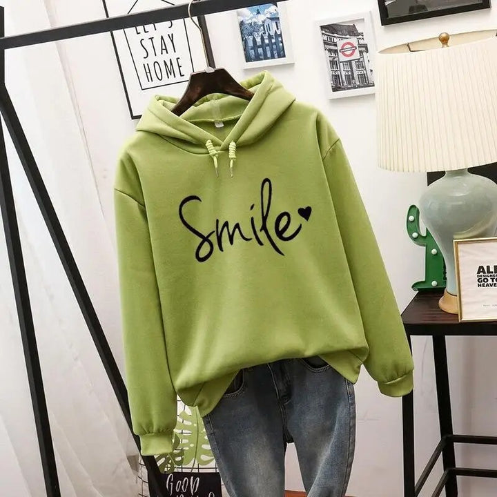 Casual women's graphic hoodie with a cozy feel & smile design. Long sleeve pullover for comfortable everyday fashion.