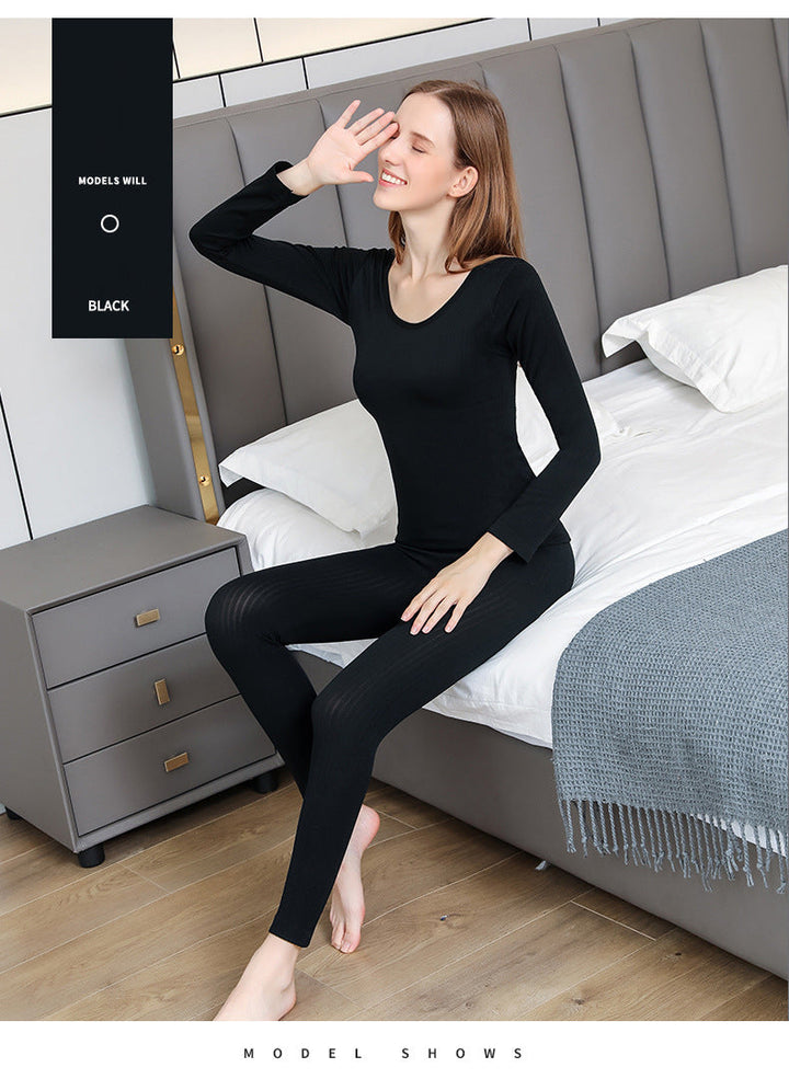 Comfortable women's thermal set for layering, ideal for winter sports or loungewear.