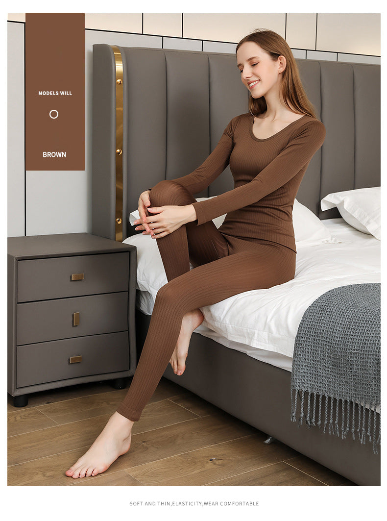 Two-piece women's thermal base layer, designed for cozy warmth and a sleek fit.