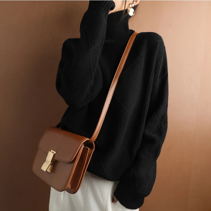 Warm women's knit turtleneck sweater, a cozy long sleeve top for stylish winter outfits.