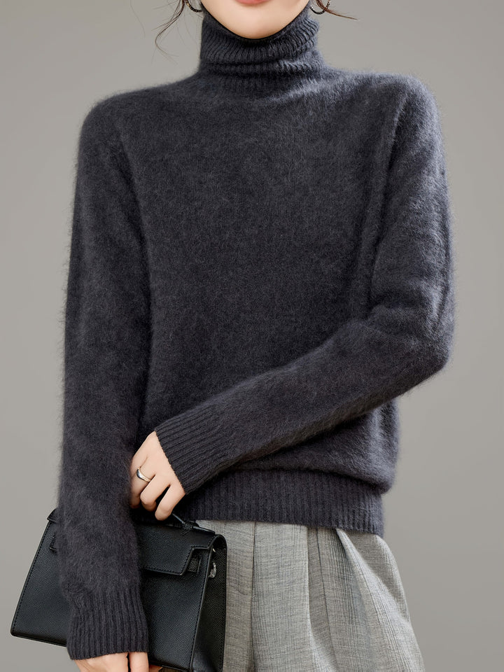 Long-sleeve women's cozy turtleneck sweater, essential warm clothing for stylish winter comfort.