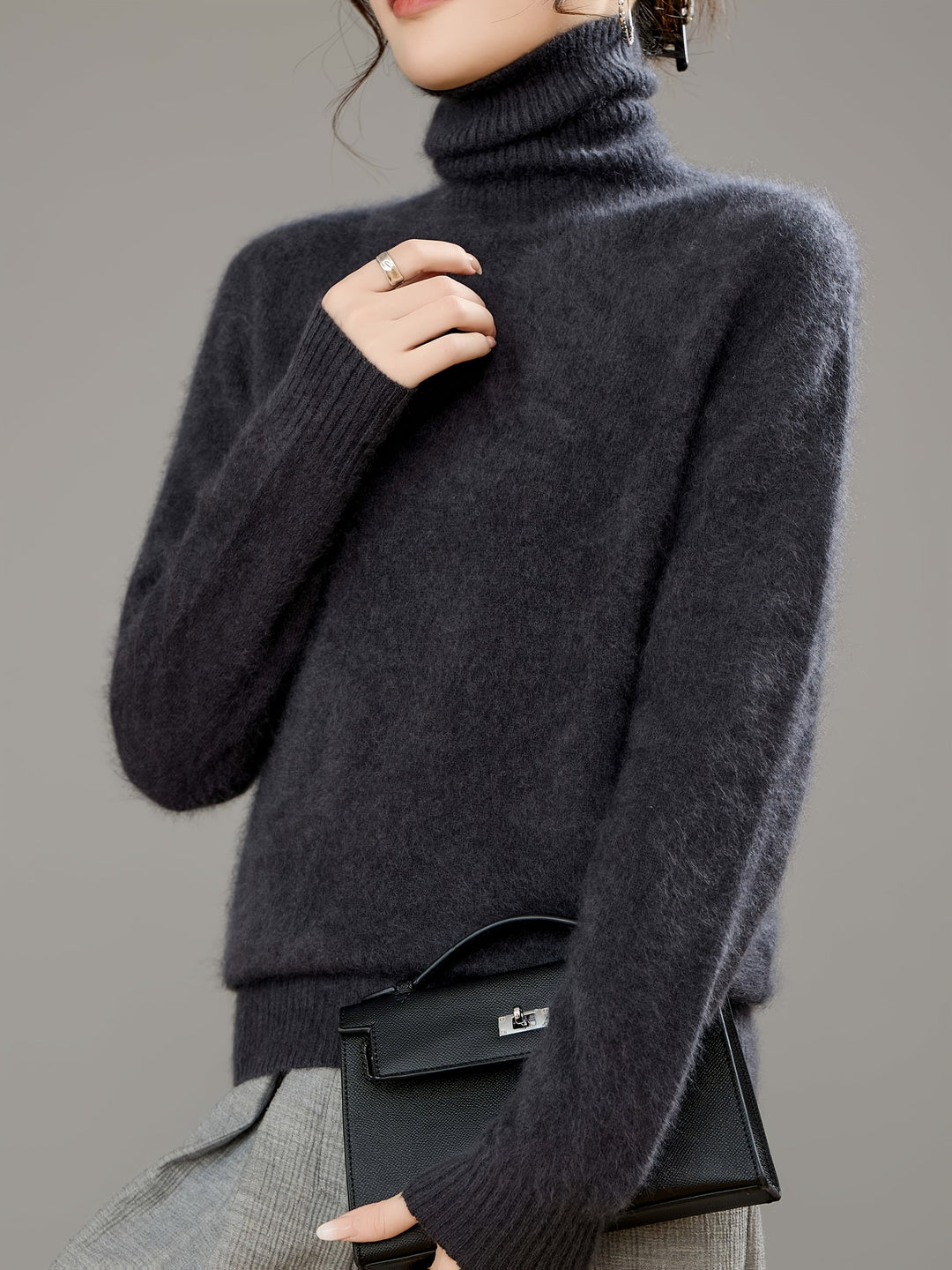 Soft knit oversized turtleneck sweater for women, ideal warm clothing for cold winter days.