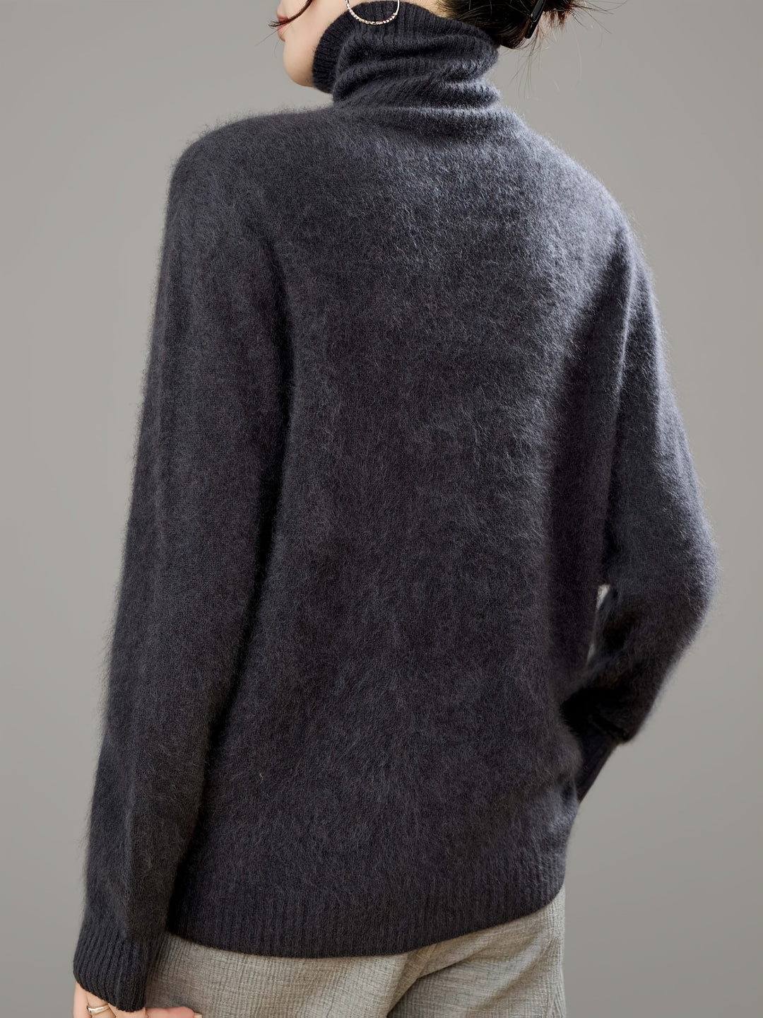Luxuriously cozy women's turtleneck sweater, designed for maximum comfort in winter fashion trends.
