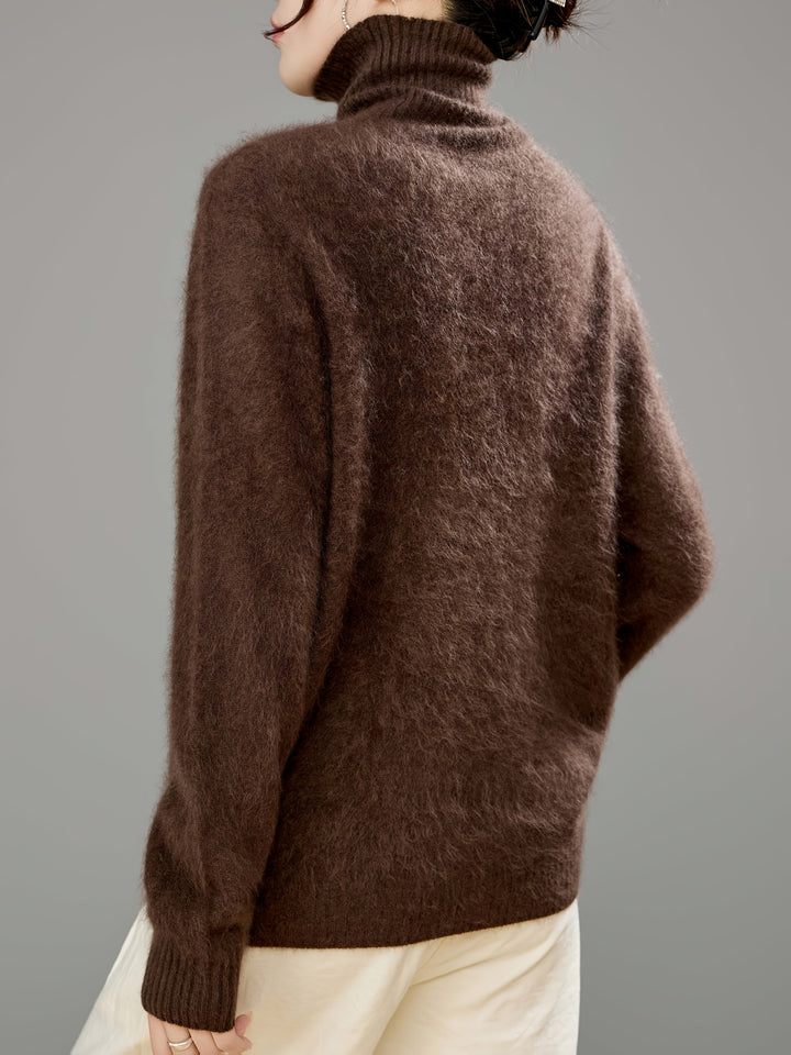 Oversized women's cozy turtleneck sweater, perfect stylish knitwear for relaxed winter comfort.