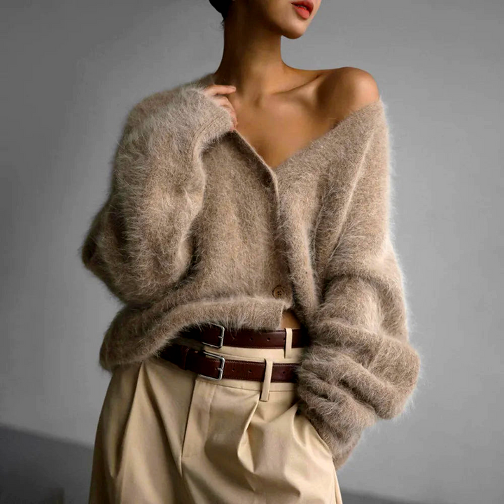 Oversized women's cardigan in a soft, cozy texture. Casual v-neck button-up, perfect everyday layering piece.