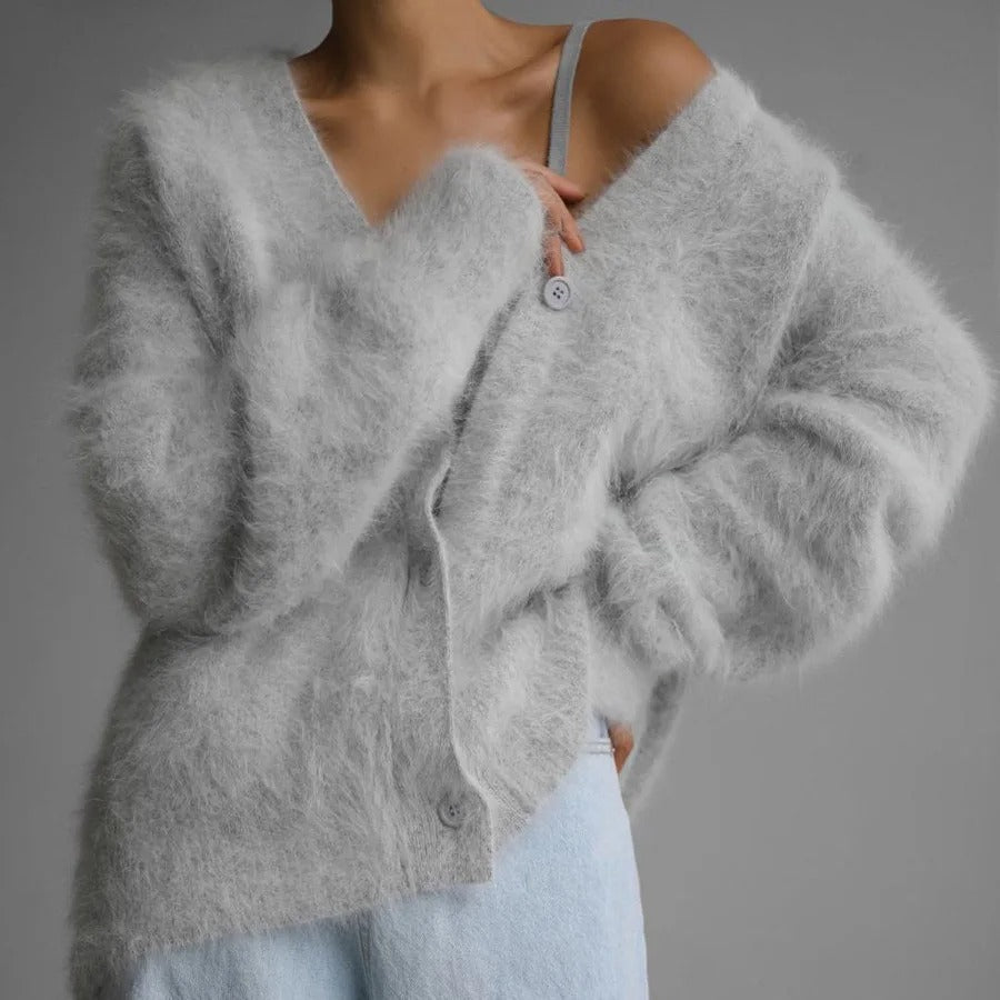 Versatile women's cozy v-neck cardigan. Oversized relaxed fit, soft texture button-front for casual everyday wear.
