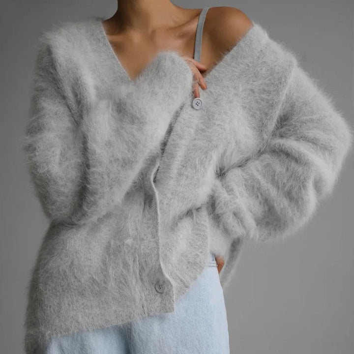 Versatile women's cozy v-neck cardigan. Oversized relaxed fit, soft texture button-front for casual everyday wear.