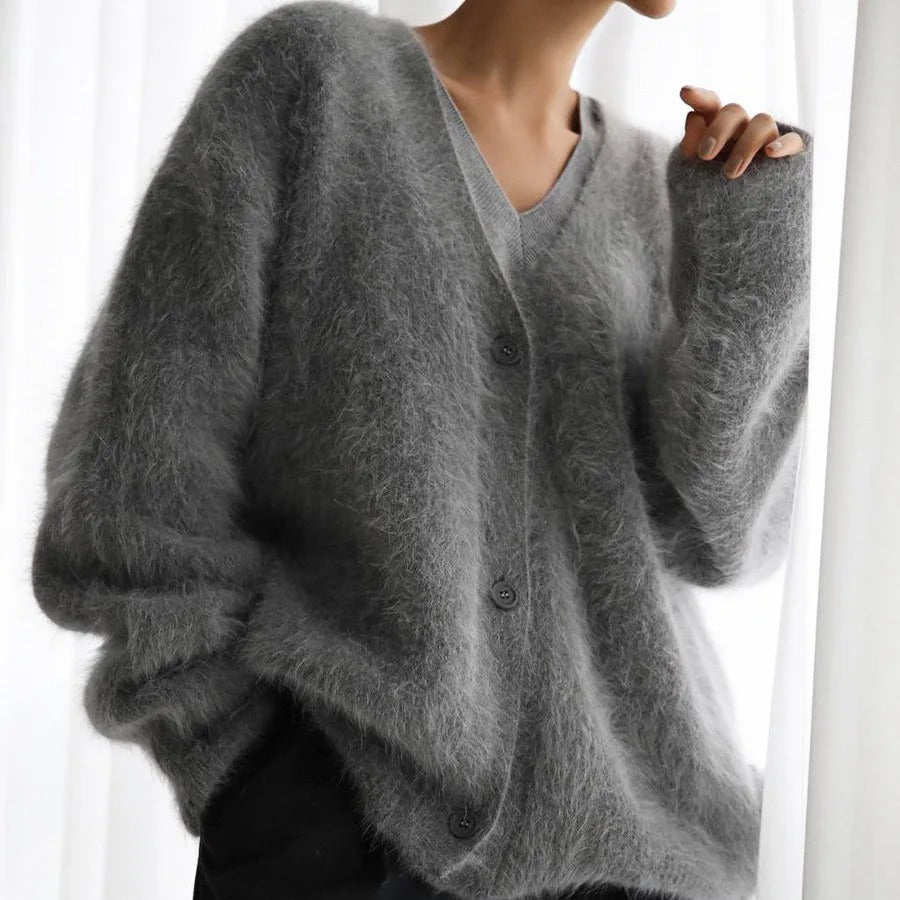 Women's warm v-neck cardigan in a relaxed fit. Soft button-front knit sweater, a cozy layering piece for winter.