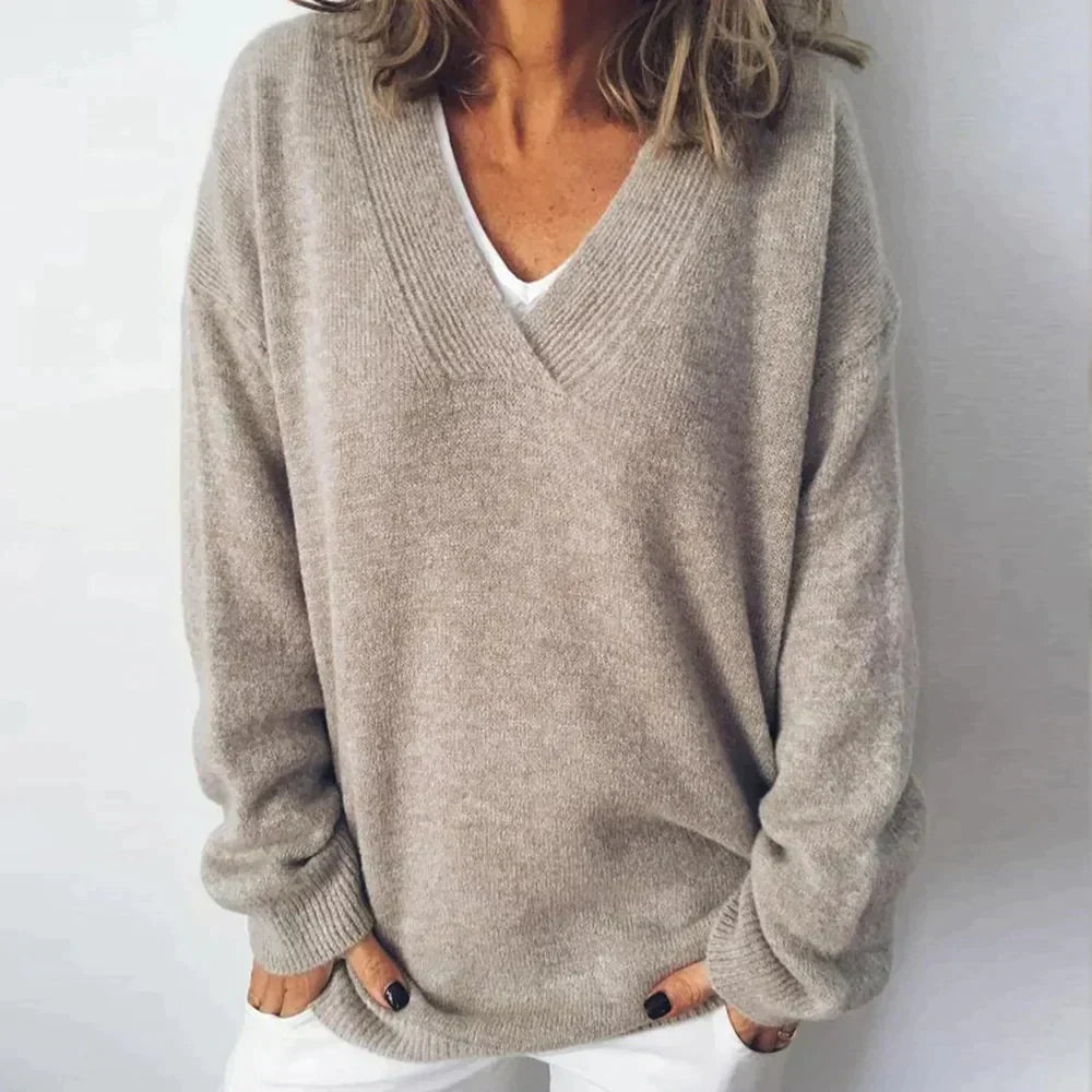 Women's cozy V-neck knit sweater in a relaxed fit, perfect for casual everyday wear in fall and winter.