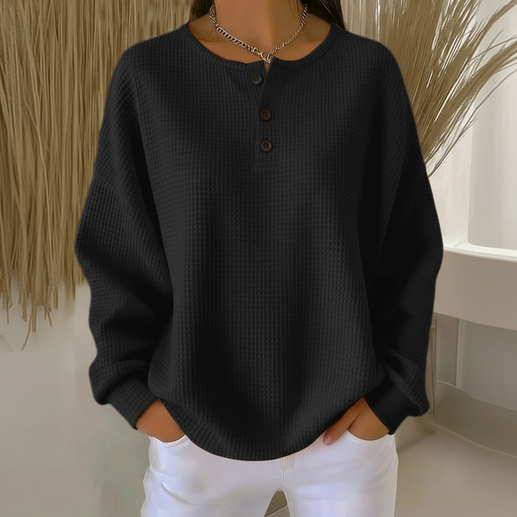 Black women's relaxed fit waffle knit pullover sweater, ideal for cozy everyday comfort and versatile autumn fashion.
