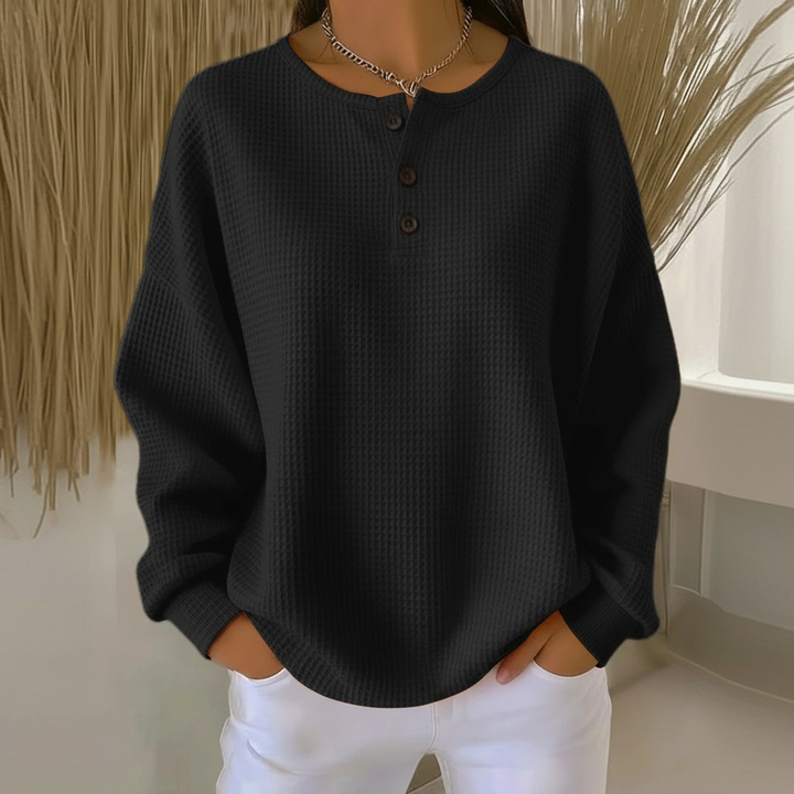 Black women's relaxed fit waffle knit pullover sweater, ideal for cozy everyday comfort and versatile autumn fashion.