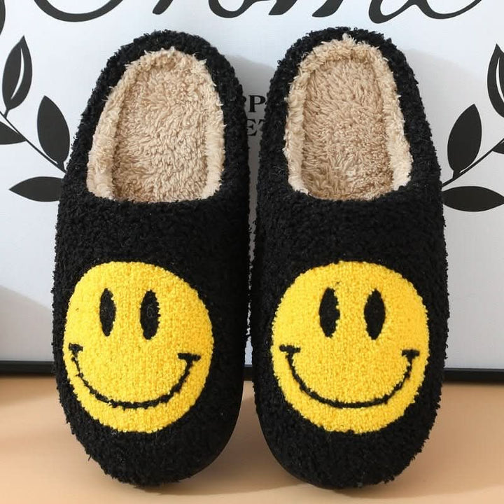 Essential winter women's slippers: cozy, soft, and warm with a smiley design and a thick non-slip sole.