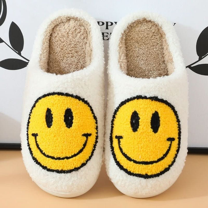 Casual women's smiley slippers, perfect for cozying up at home. Thick sole provides extra comfort.