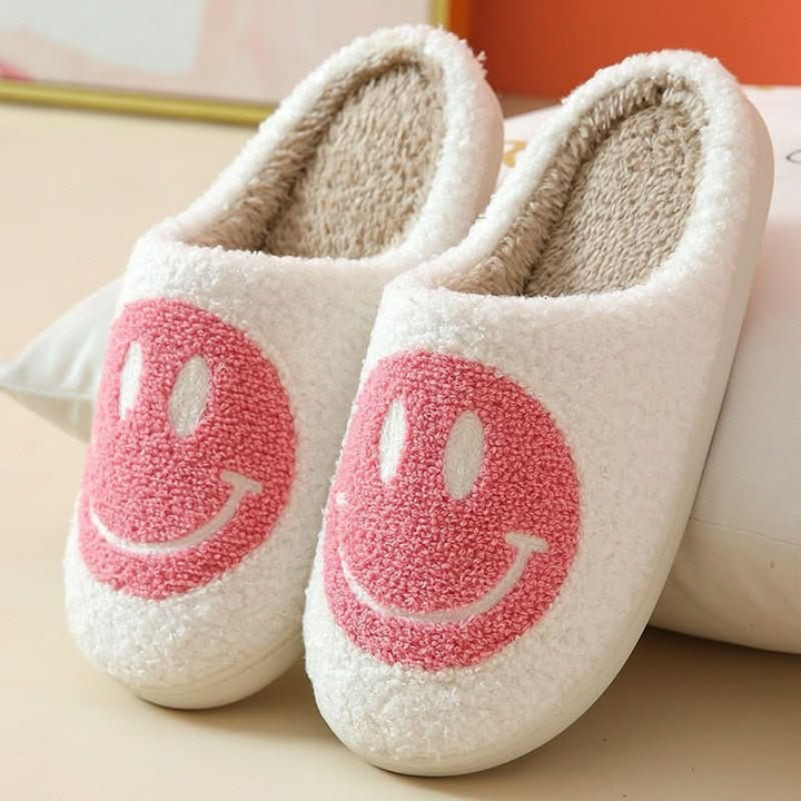 Thick-soled women's indoor slippers with a playful smiley, offering ultimate comfort and warmth for home.