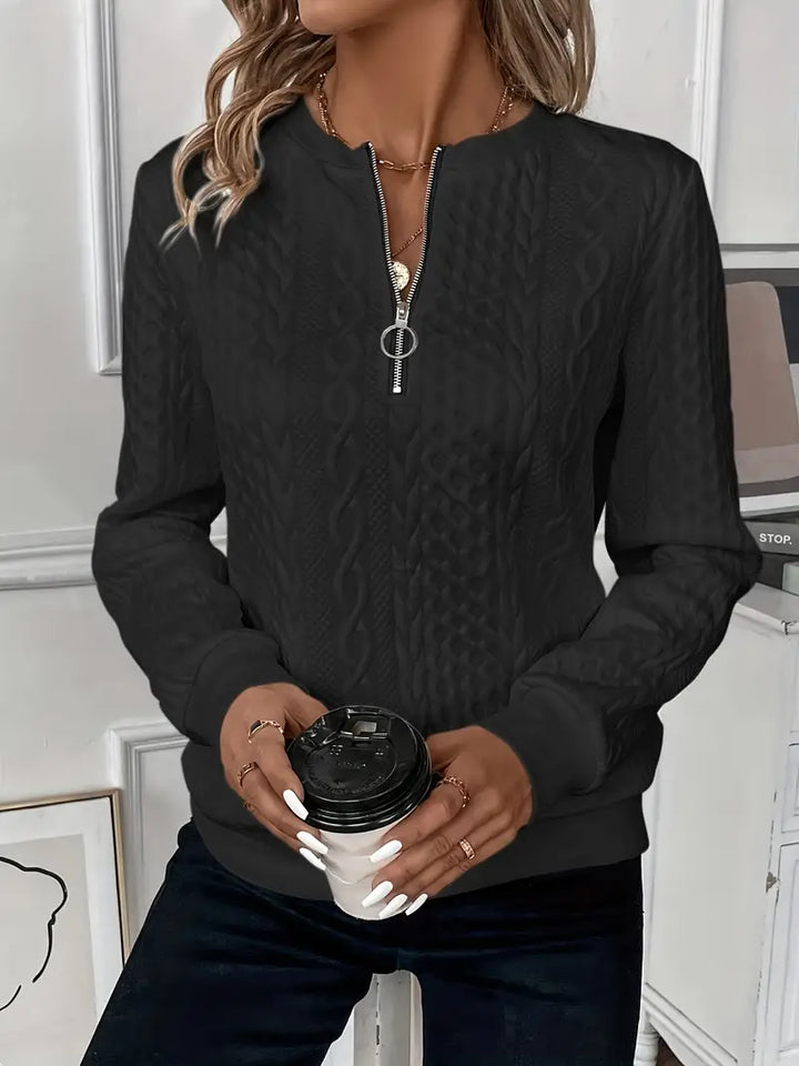 Women's comfortable zippered sweater, a stylish top for casual outings and relaxed comfort.