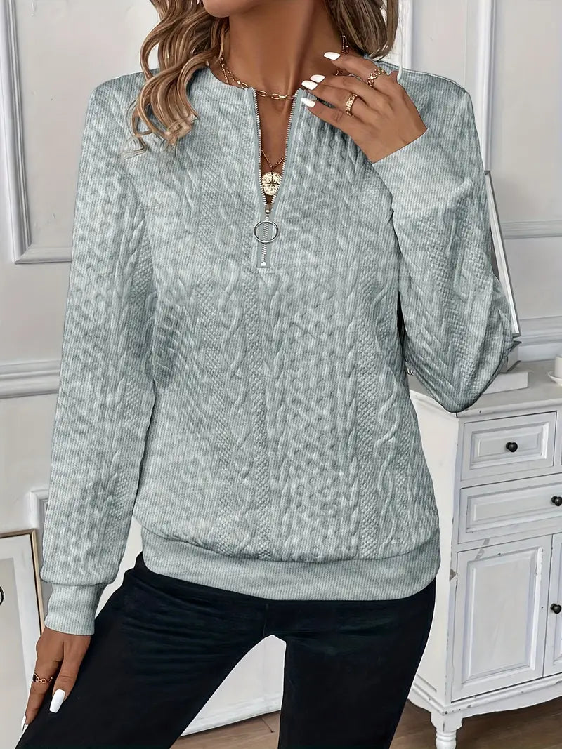 Model wearing a women's cozy zippered sweater, demonstrating its versatile style and comfort.