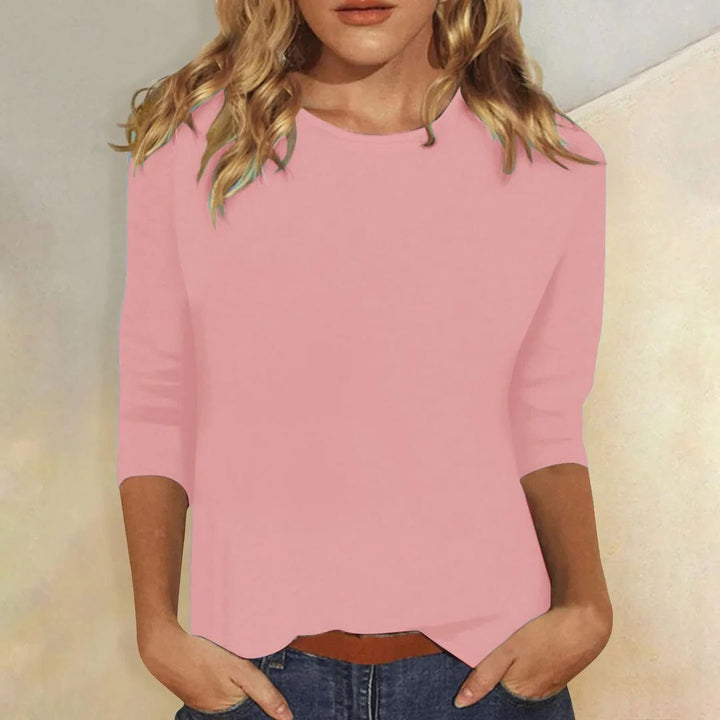 Women's crew neck 3/4 sleeve relaxed fit top for casual everyday wear.