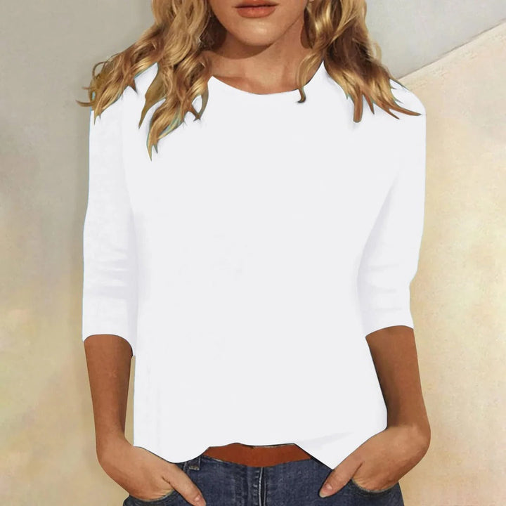 Comfortable women's relaxed fit 3/4 sleeve crew neck top, ideal for layering.