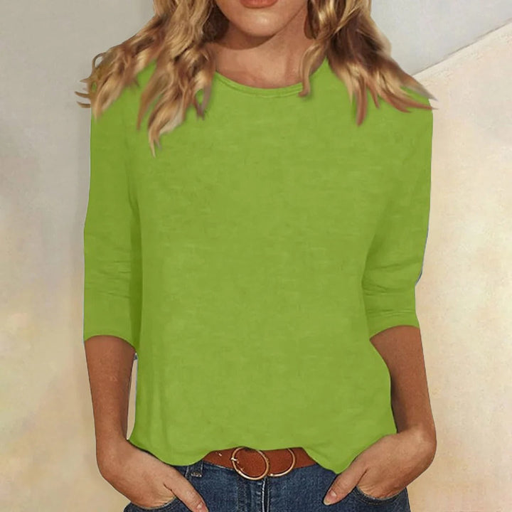 Casual women's 3/4 sleeve top, featuring a comfortable crew neck and relaxed fit.